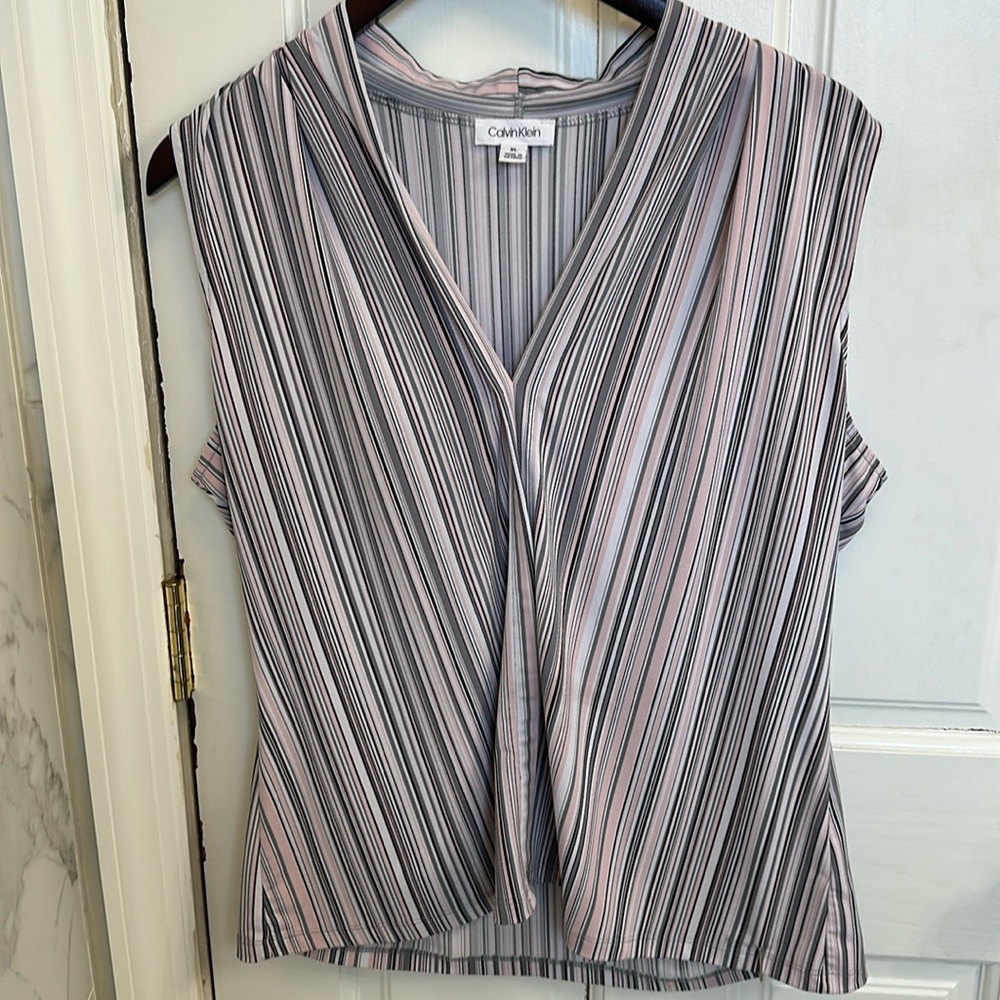 This is a nice  blouse to wear with a black blazer